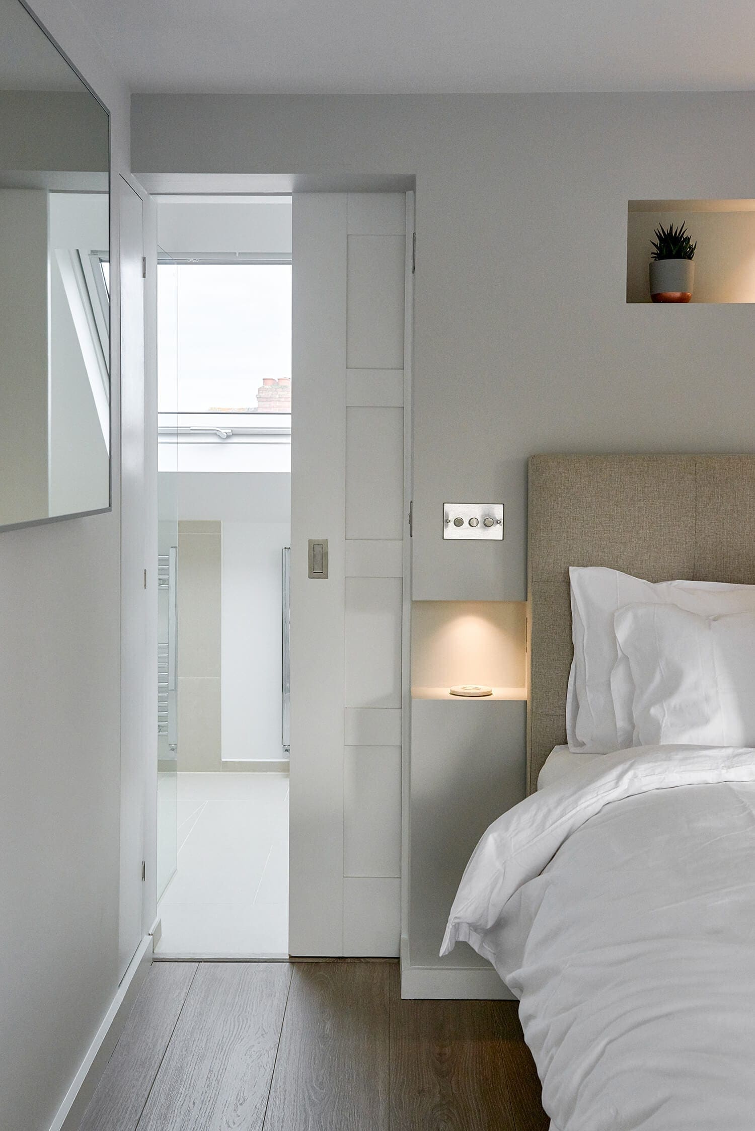 space-saving internal door separates loft bedroom from ensuite