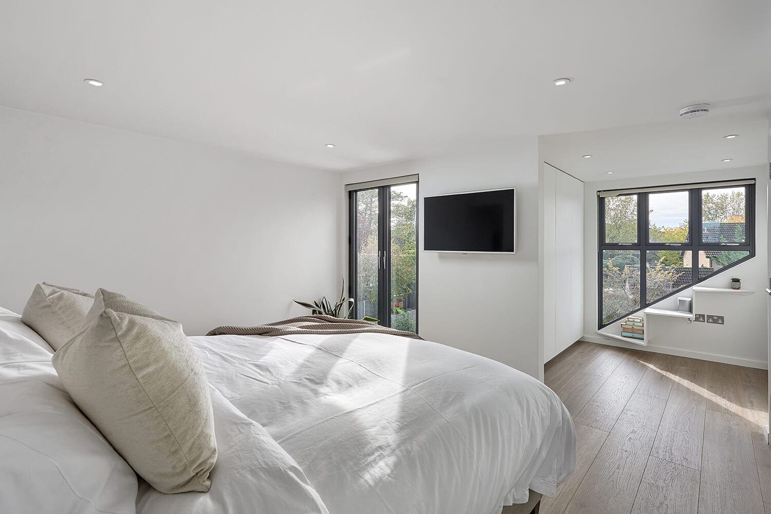 minimalist loft conversion design with juliet balcony and walk in wardorbe