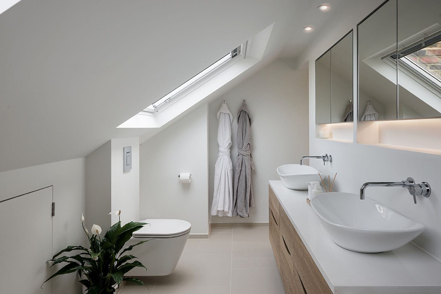 luxury master bathroom suite with pitched roof