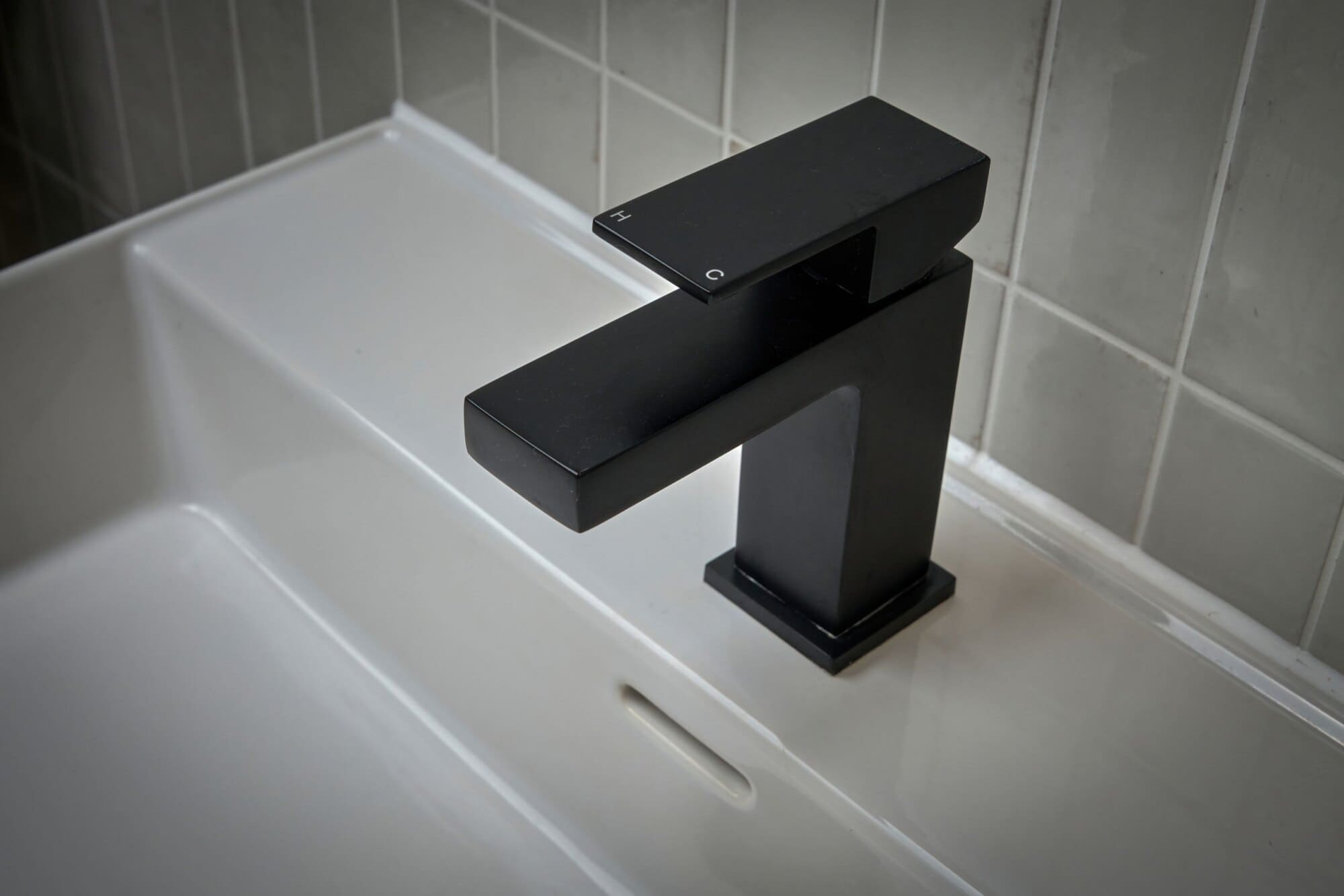 black sink faucet of loft conversion bathroom