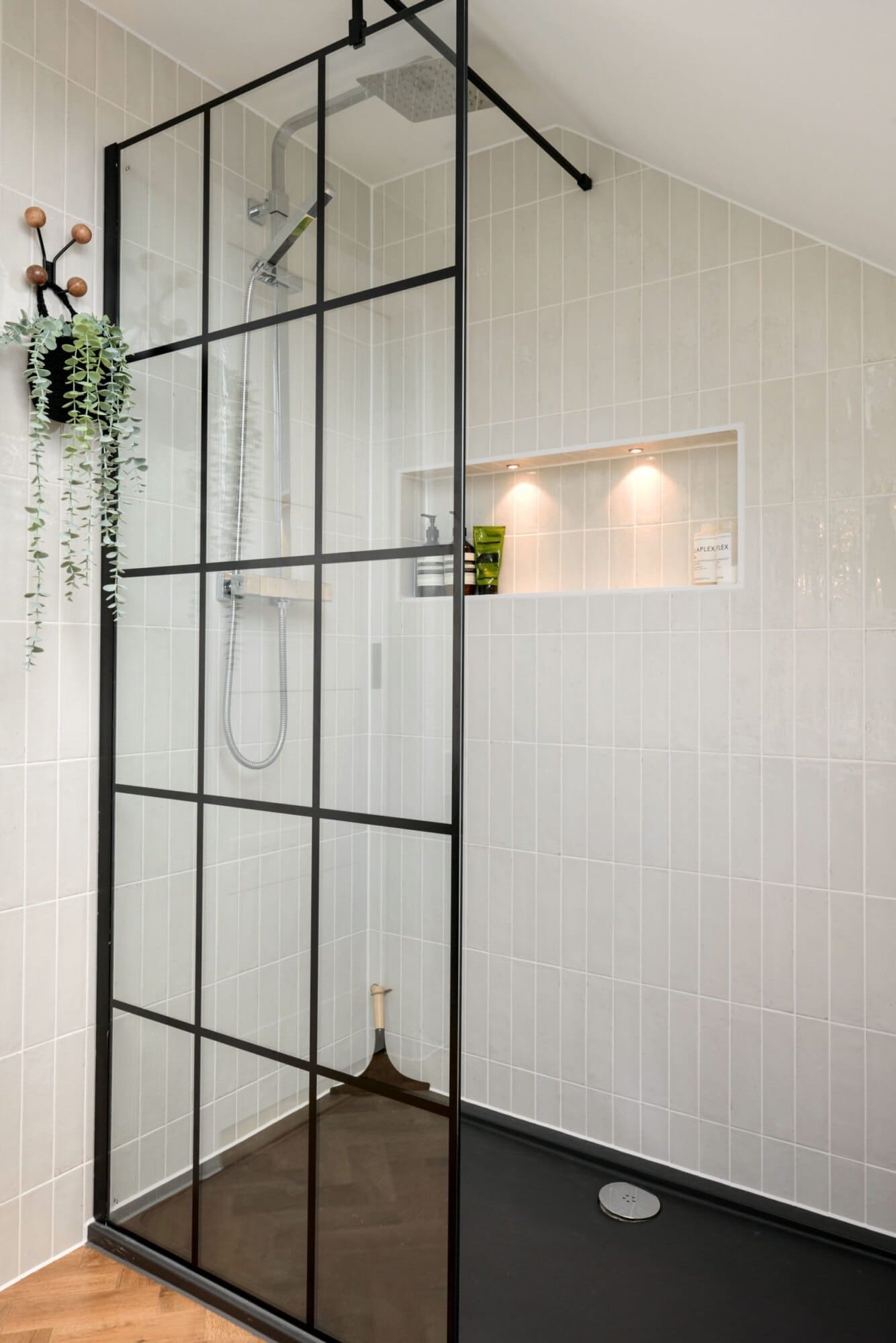 pitched roof loft shower suite with glass shower screen and wall alcove