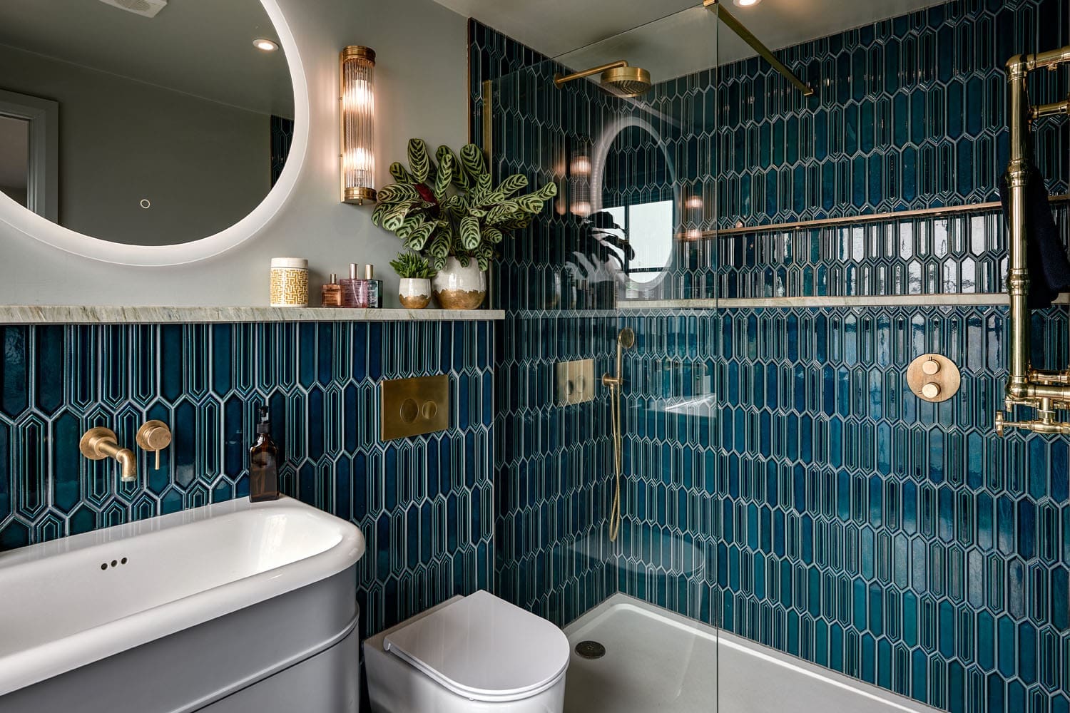 loft conversion in conservation area - loft conversion bathroom with electric blue tiles