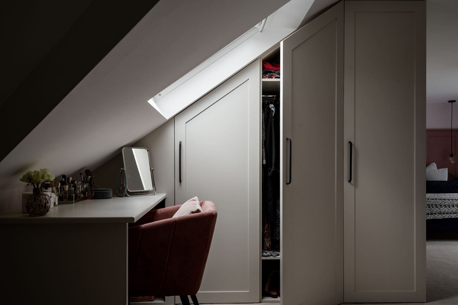 rear dormer with skylight window bring light over custom wardrobe storage