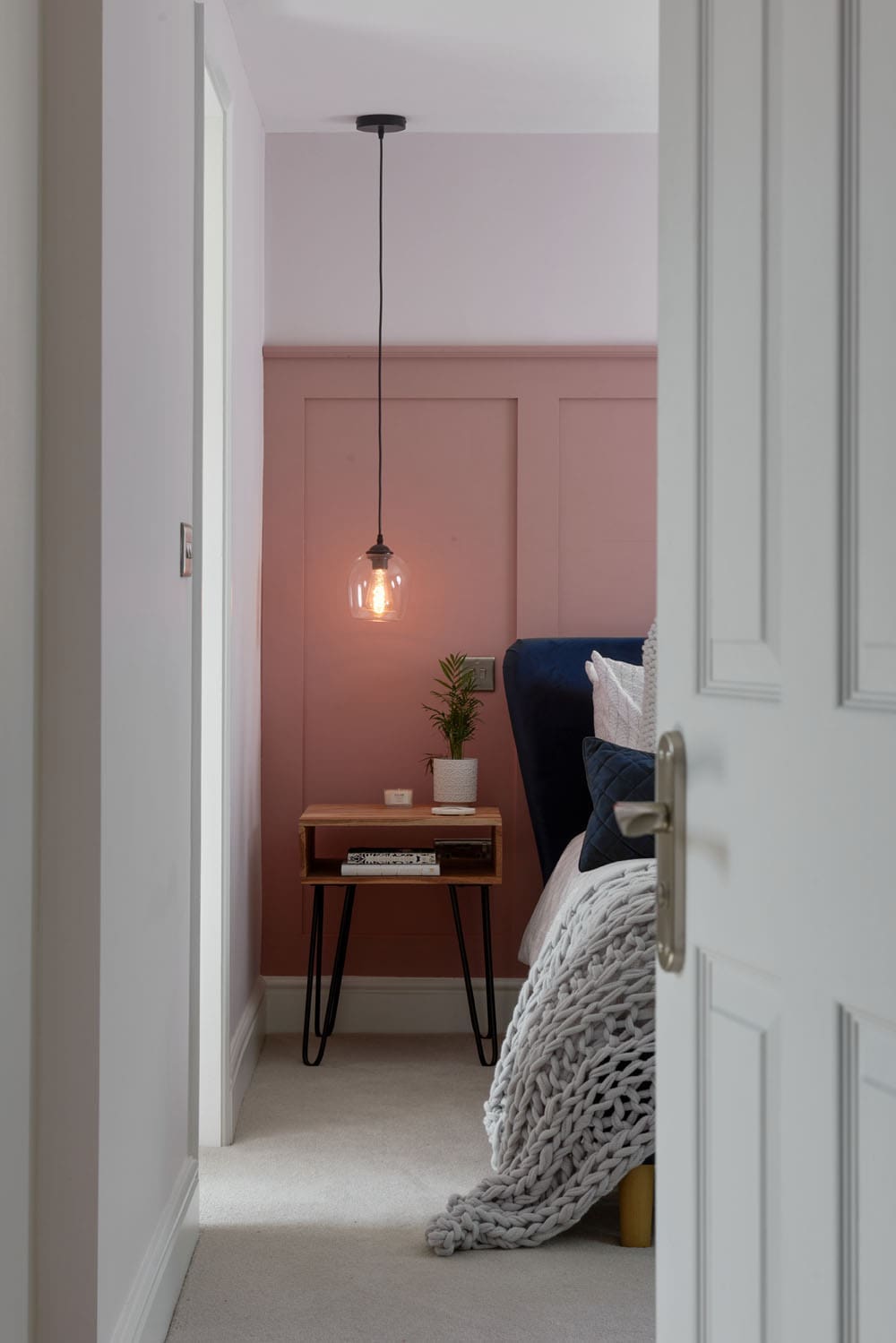 rear dormer loft conversion bedroom with pink wall panelling and modern interior