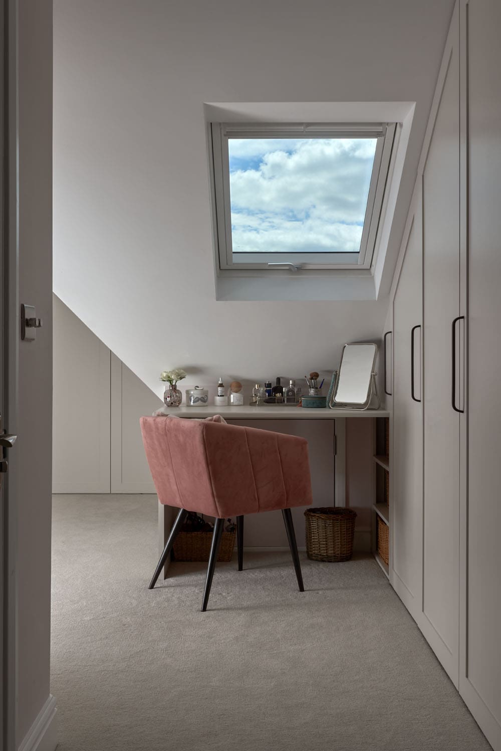 walk in-wardrobe space with roof light and vanity table