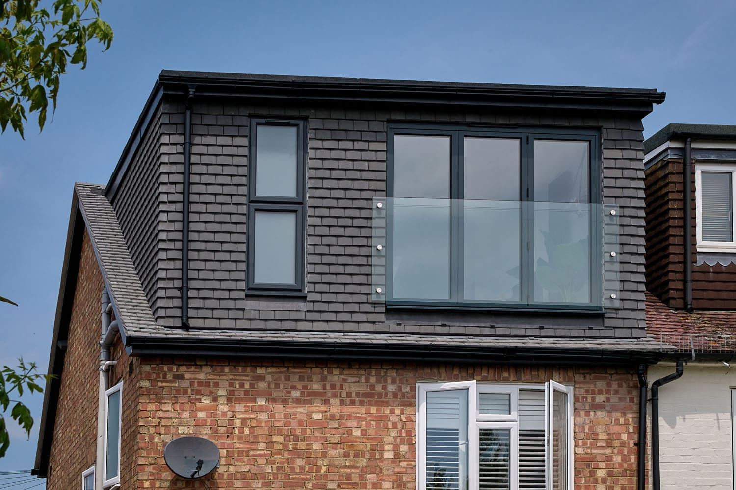 rear dormer exterior with velux and bifold windows and glass balcony