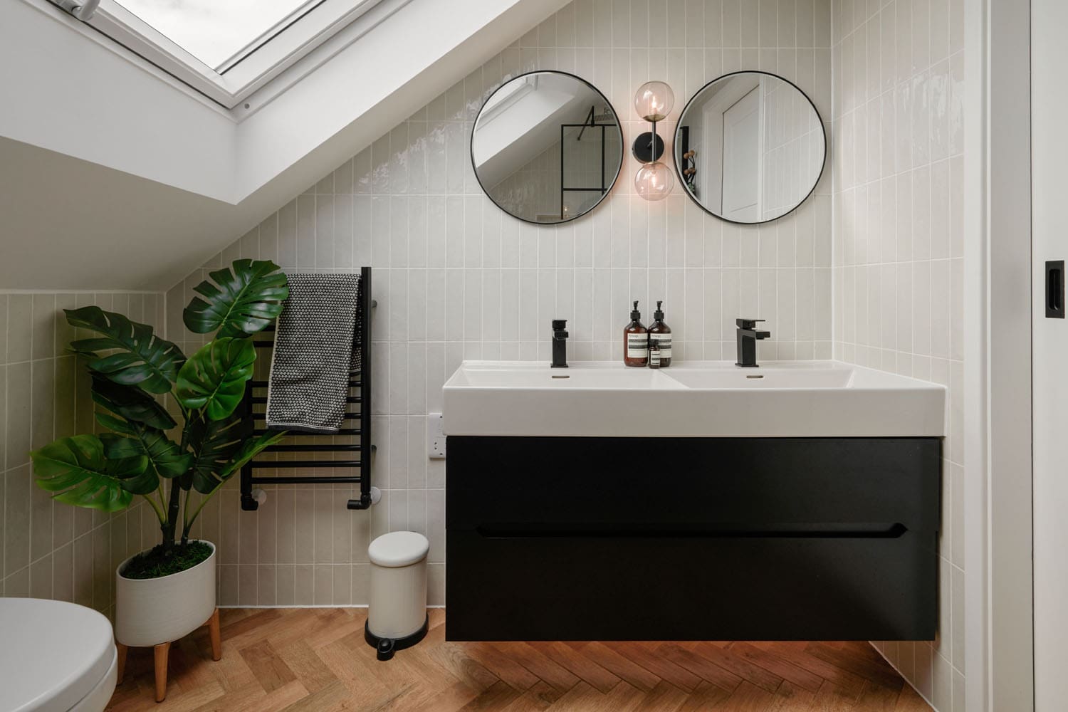monochrome loft bathroom with mounted dual sinks